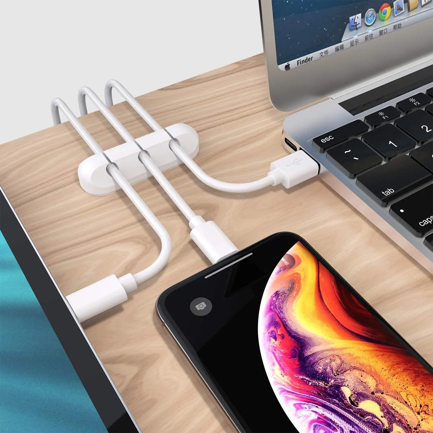 White silicone desk cable organizer clip bar with slots for multiple connected charging cables