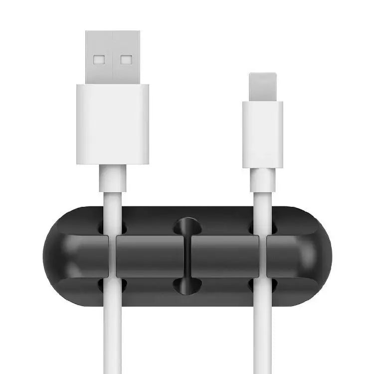 White silicone cable organizer with two upright USB connectors in the slots