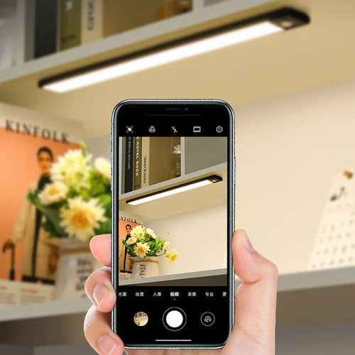 Smart LED bar light controlled on a phone screen, showing bright overhead glow