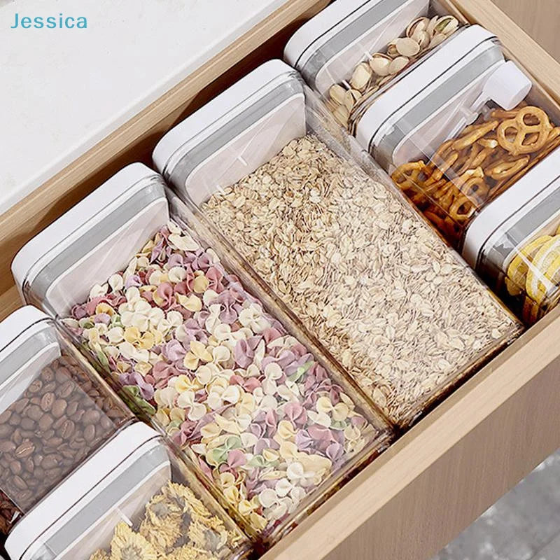 Stacked airtight food containers with white push-lock lids, clear sides filled with grains